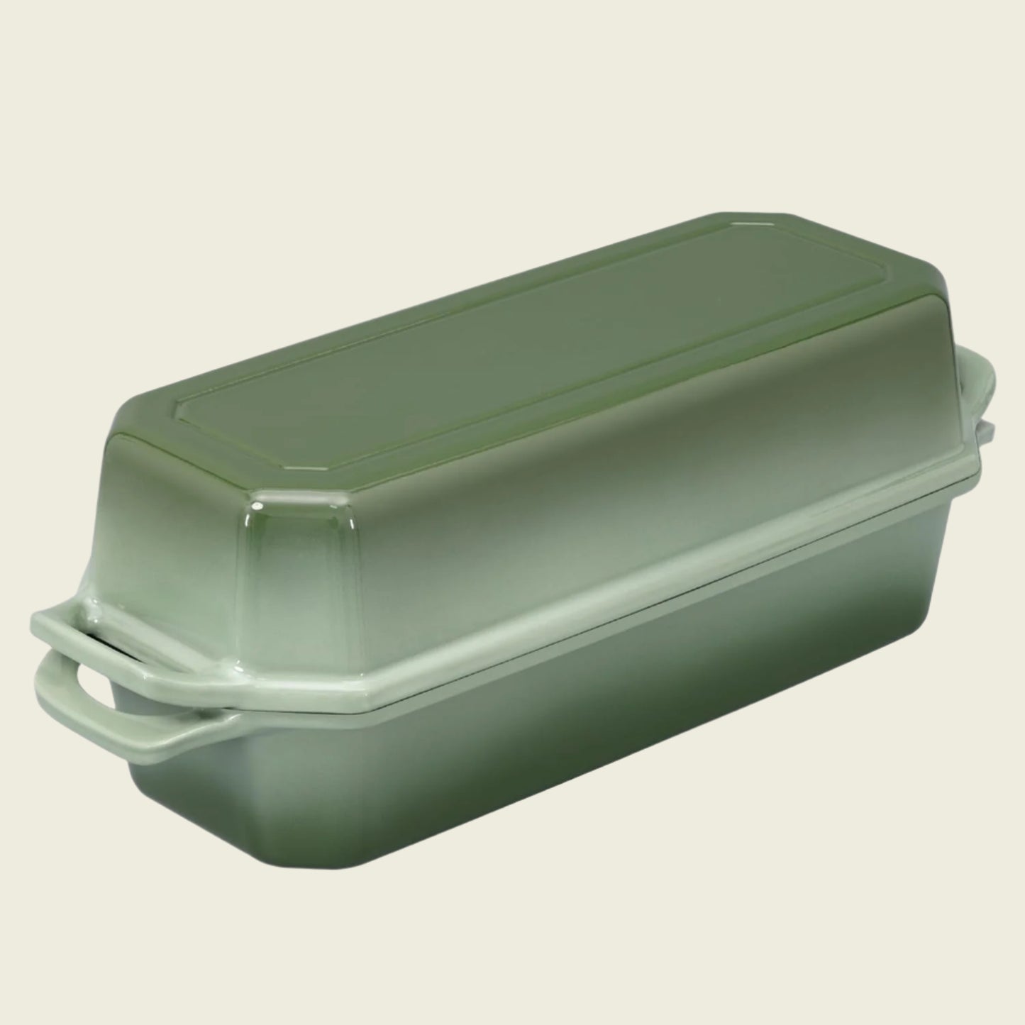 Green rectangular baking dish with a lid on a white background