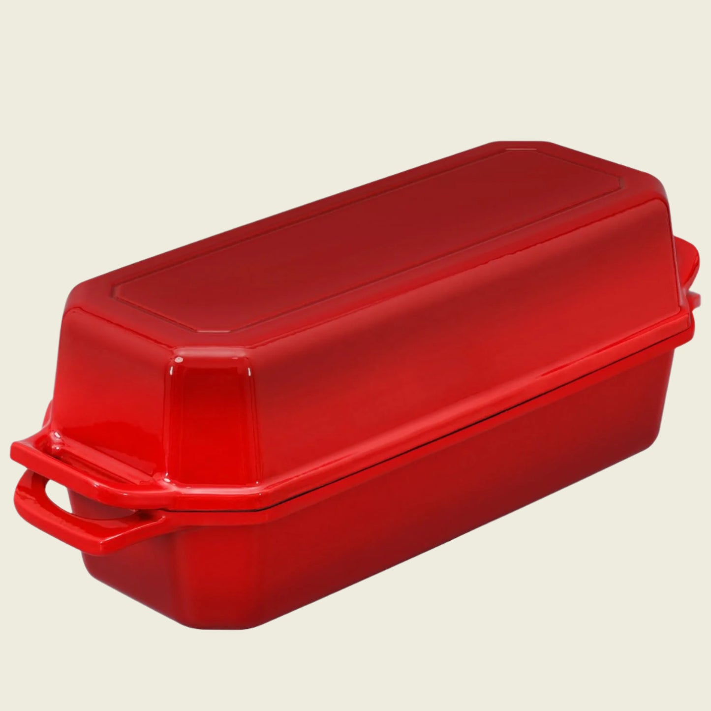 Red rectangular baking dish with a lid on a white background