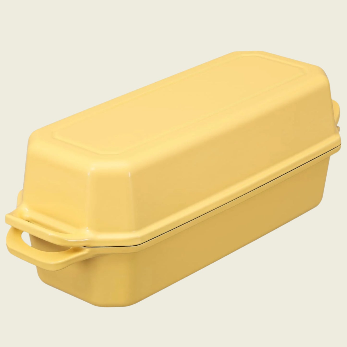 Yellow rectangular baking dish with a lid on a white background