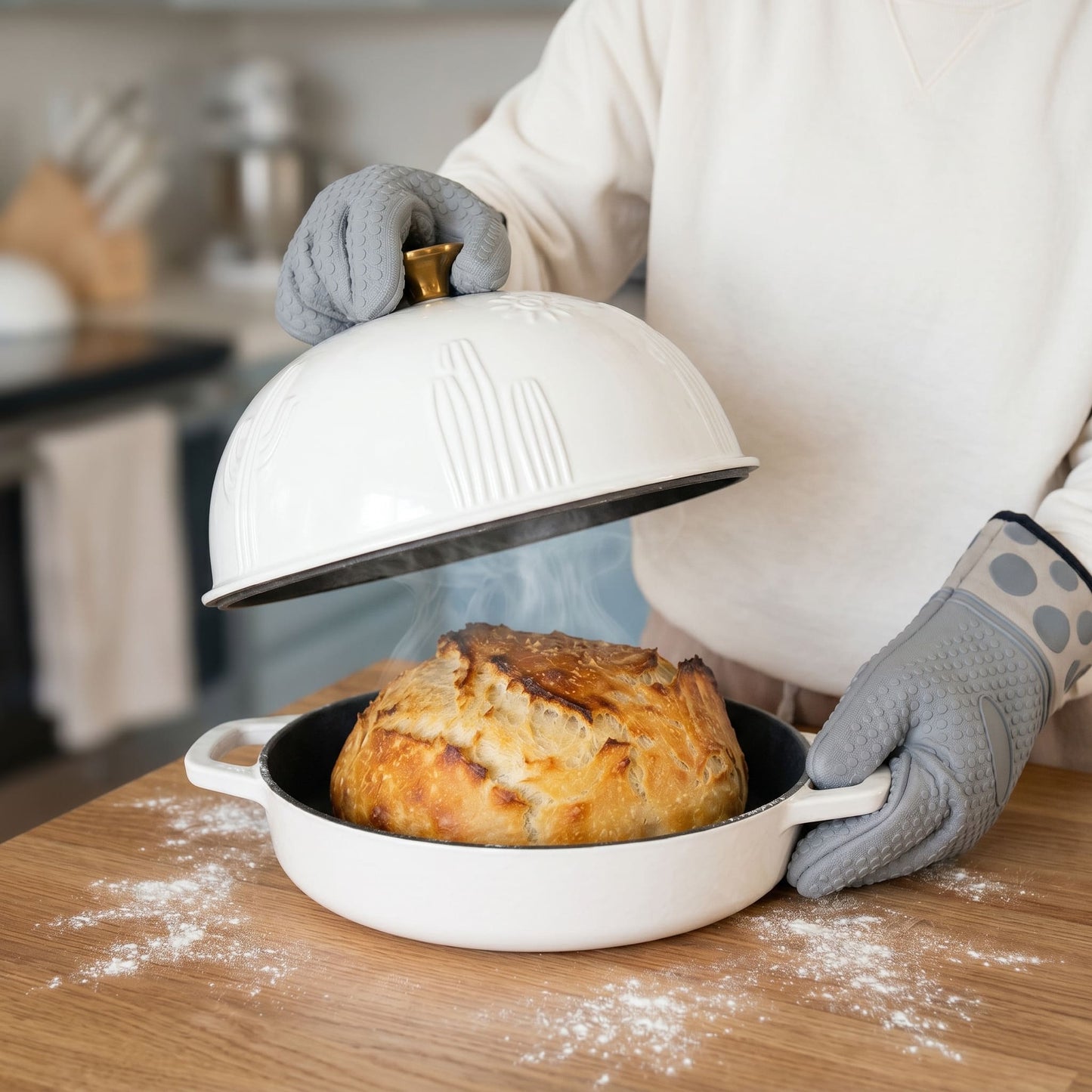 Cactus Bread Oven in Pearl White with lid on a baked loaf