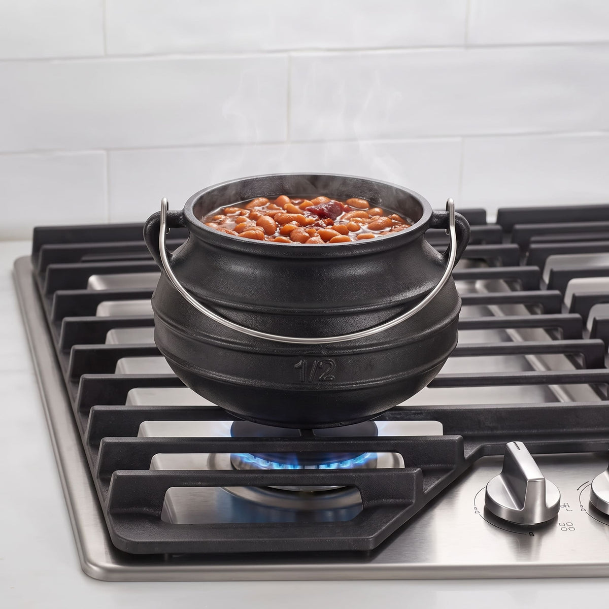 2 qt cast iron cauldron #1/2 on stovetop for baked beans