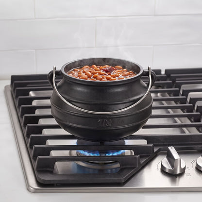 2 qt cast iron cauldron #1/2 on stovetop for baked beans