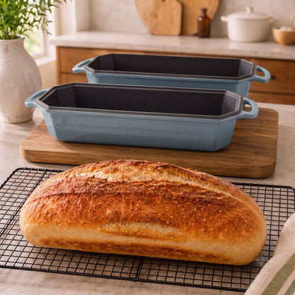 Misty blue 13x5 Inch loaf pans on an artisan loaf oven; freshly baked loaf on a cooling rack