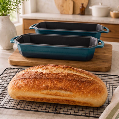 deep Cyan 13x5 Inch loaf pans on an artisan loaf oven; freshly baked bread on a cooling rack