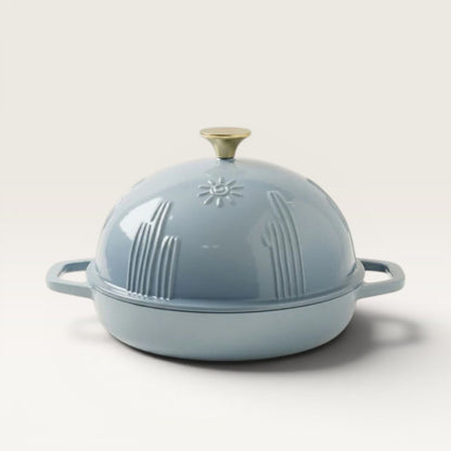 Bread oven lid with handle knob, slate-blue exterior with embossed cactus design.