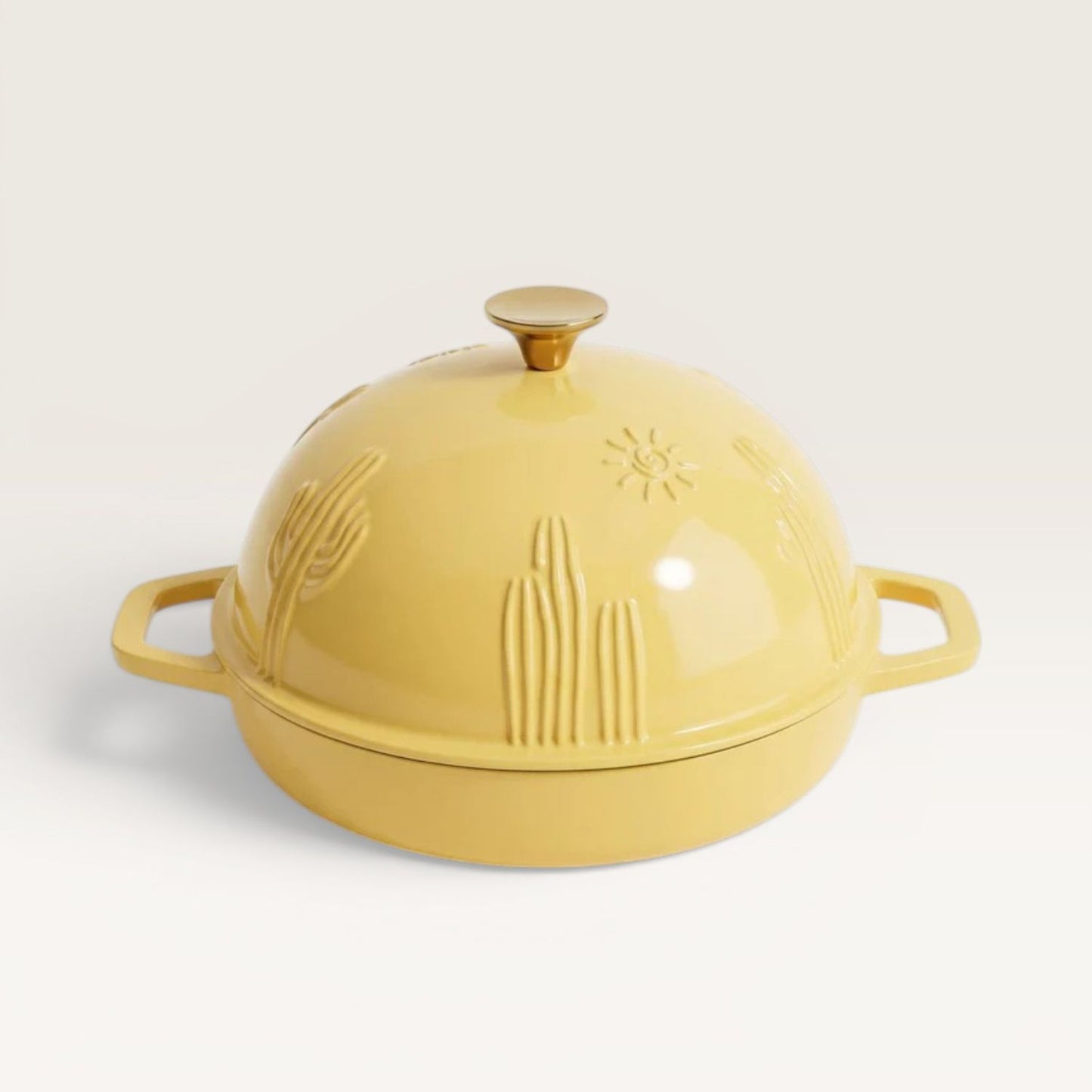 Bread oven lid with knob, sunny yellow ceramic with embossed cactus pattern.