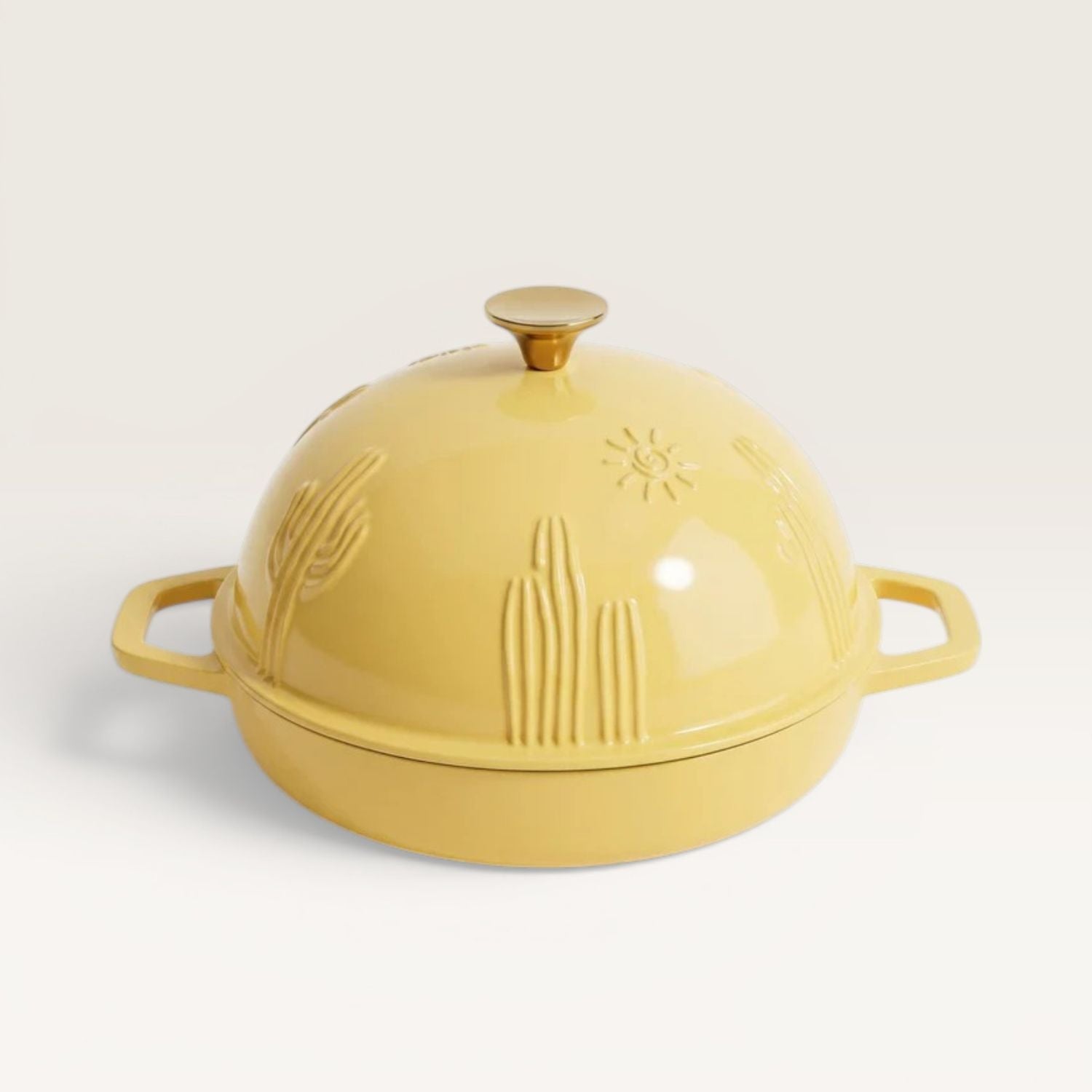 Bread oven lid with knob, sunny yellow ceramic with embossed cactus pattern.