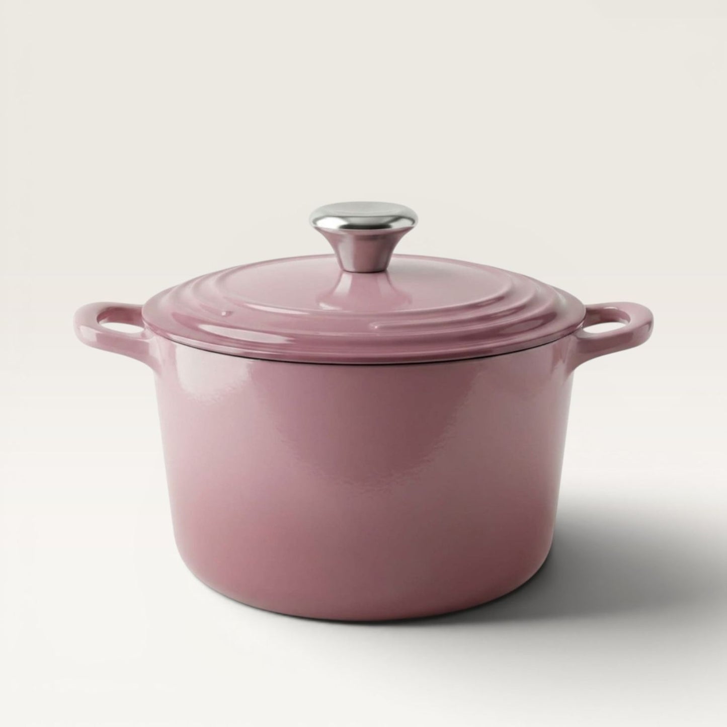 Rose pink Dutch oven with clear pink lid and metal knob, side handles