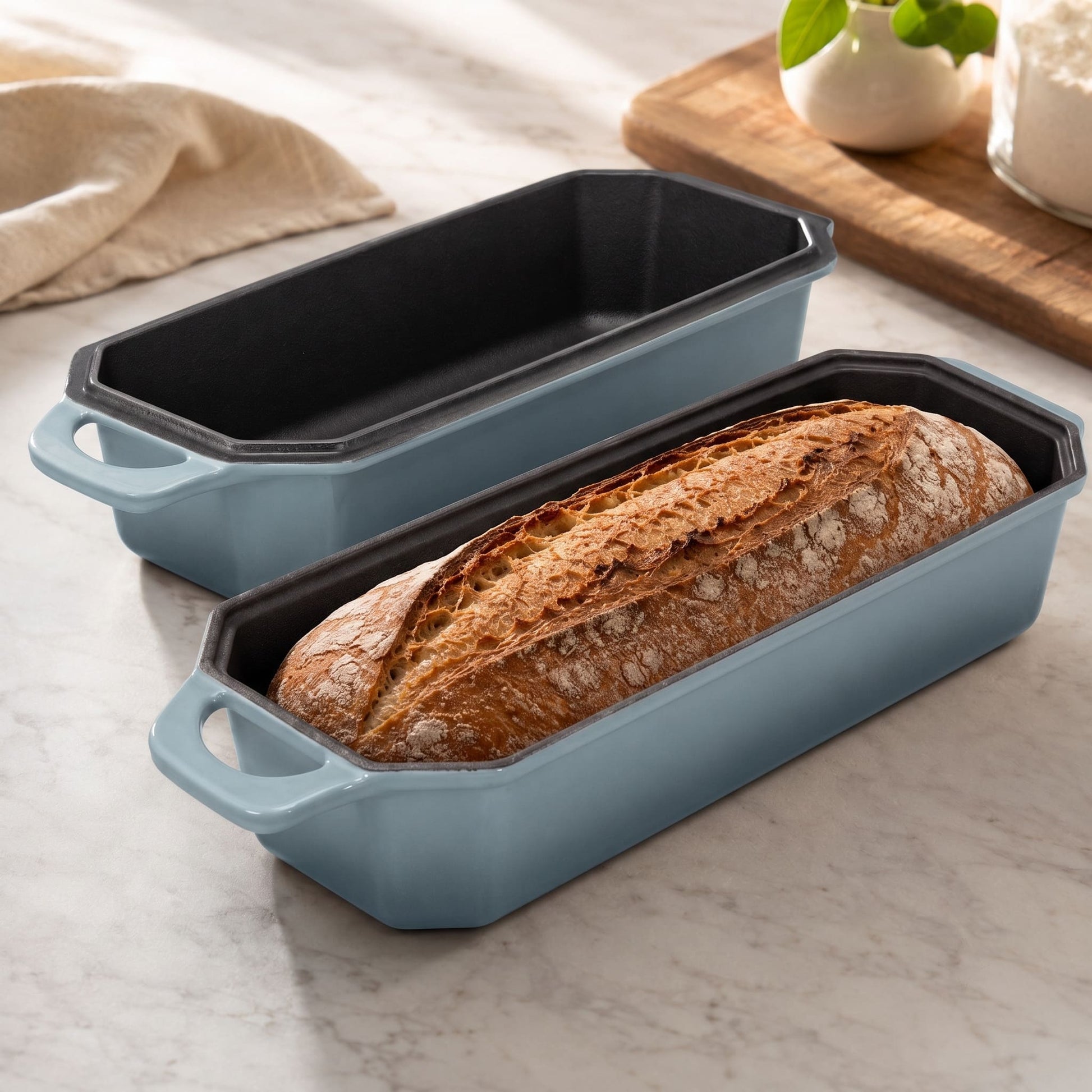 Artisan loaf oven in Misty blue, with two loaf pans and bread inside
