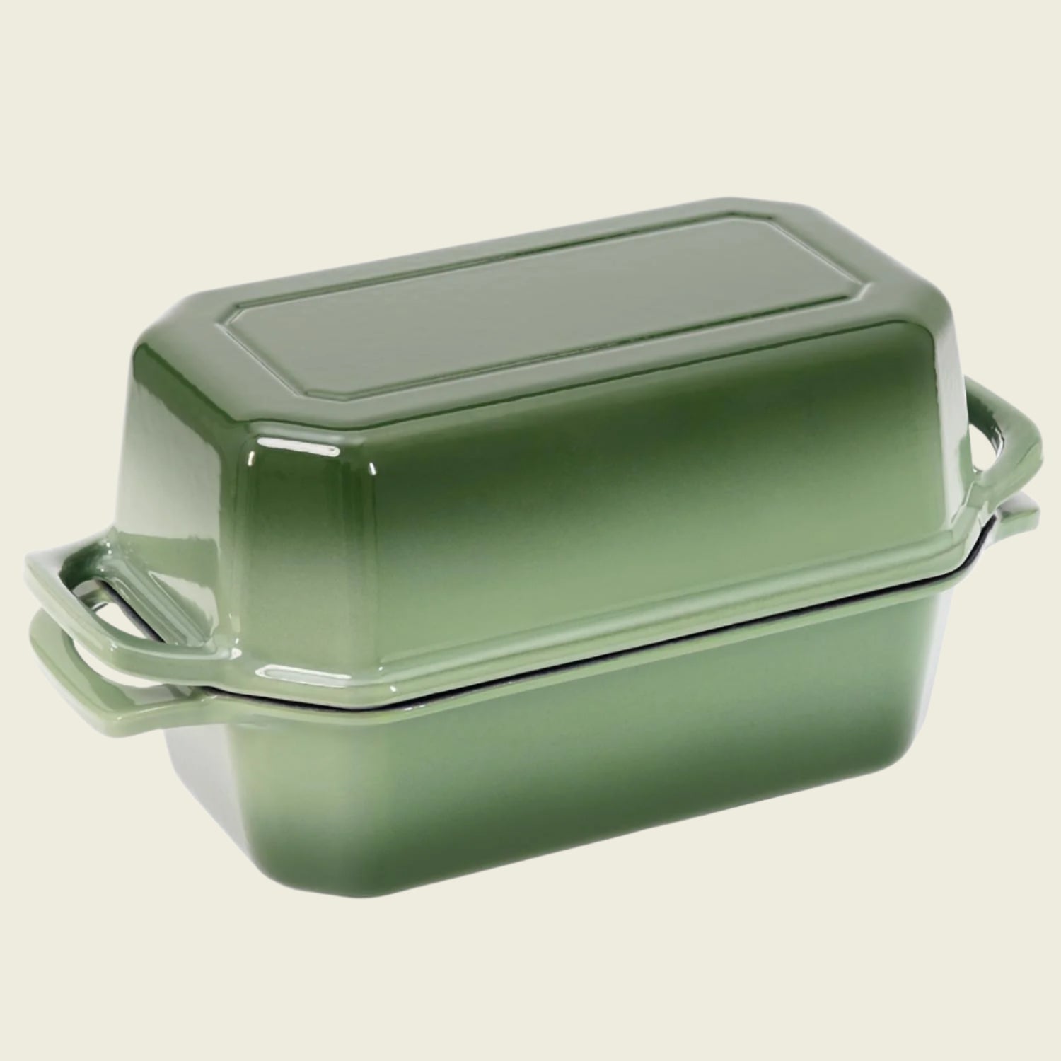 Green rectangular baking dish with lid on a white background