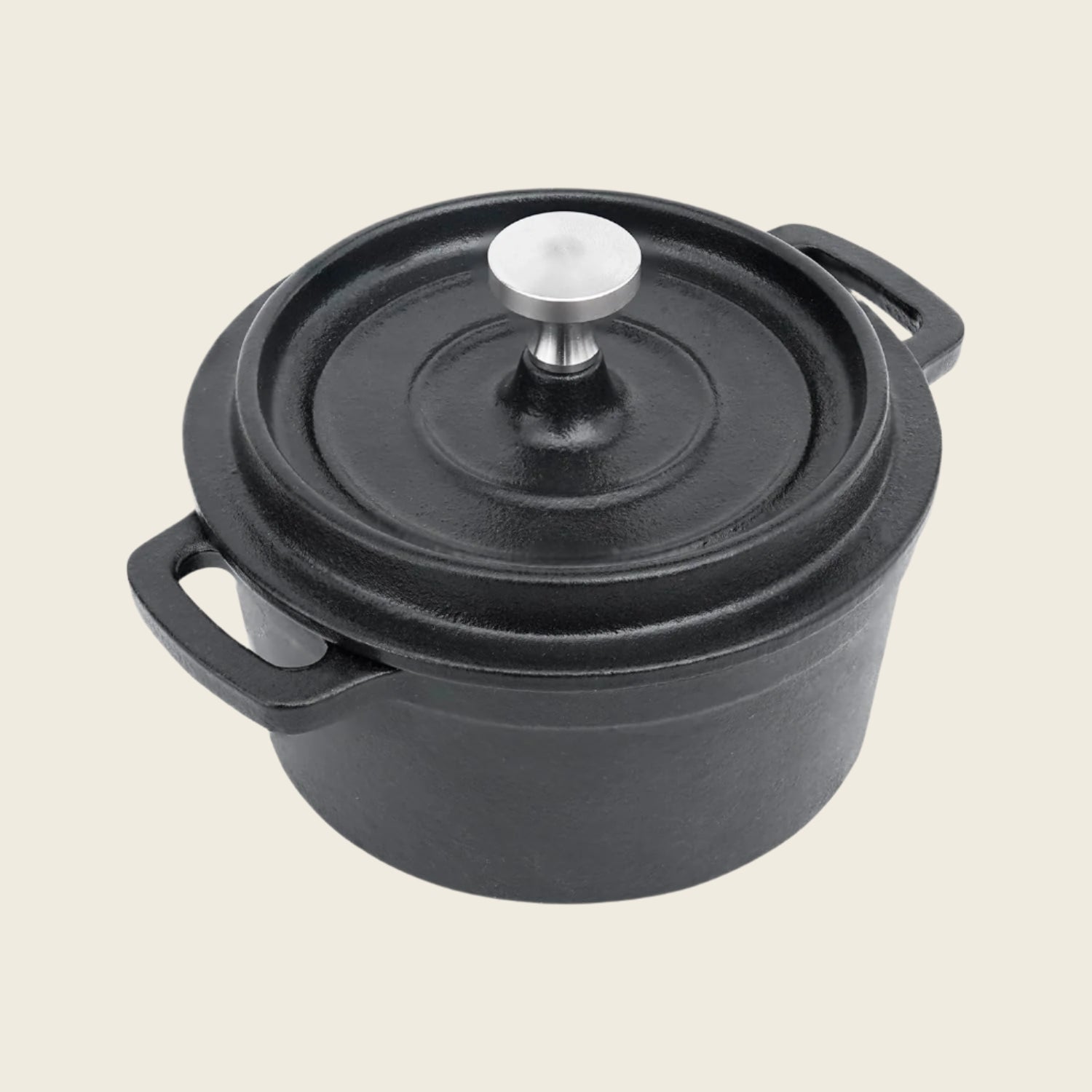 Black cast iron pot with lid on a white background