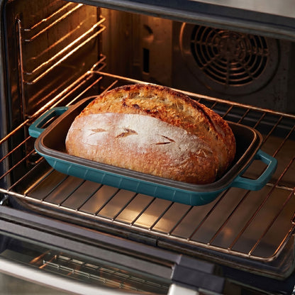 Oval bread oven with baked loaf, teal base on oven rack