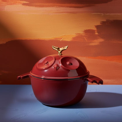 Red owl-shaped cocotte with gold finial lid and two eye-shaped wells