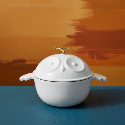 White cocotte pot with owl-shaped lid and gold finial