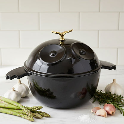 Owl-shaped cocotte in glossy black with gold knob, owl-face lid, and side handles