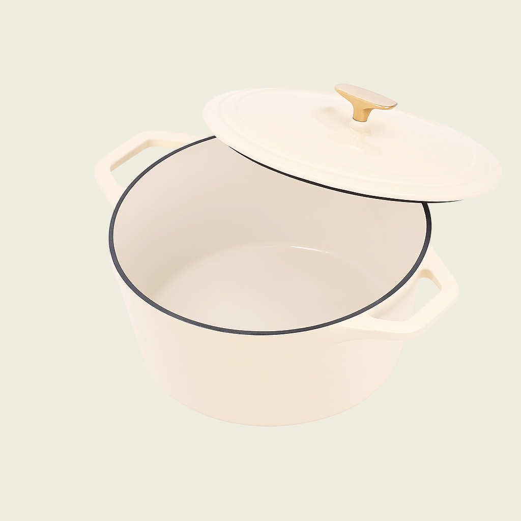 Cream-colored enameled cast iron Dutch oven with lid on a white background